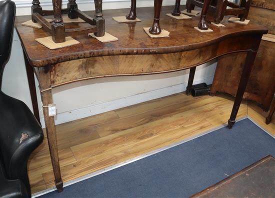 A George III mahogany serpentine serving table W.152cm
